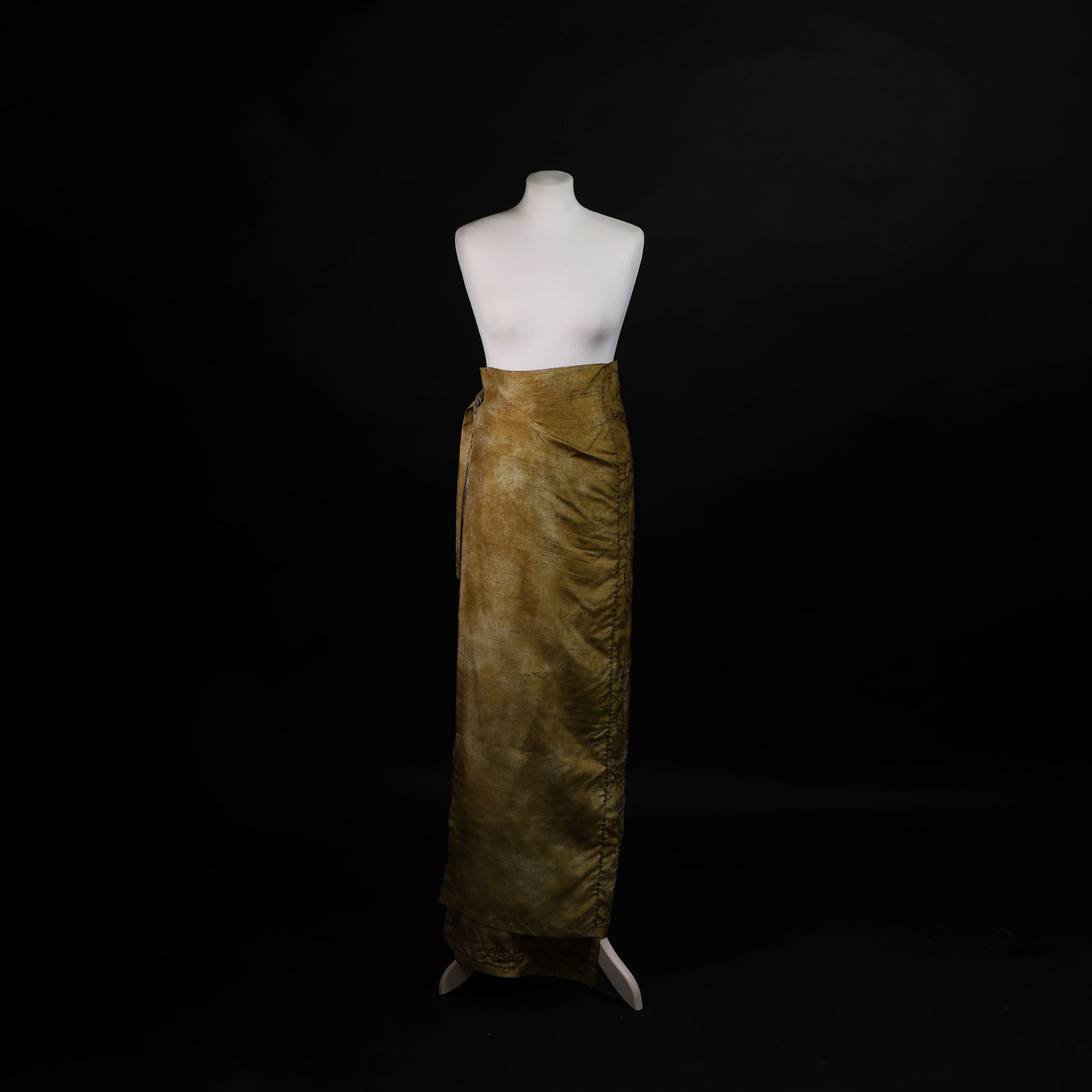 A Dries Van Noten wrap skirt: A Dries Van Noten wrap skirt c.1990s, cut in olive green and grey silk, with wrap and tie fastening, decorated with embroidered foliate motifs and appliqued sequins, with label 'Dries Van Noten', size