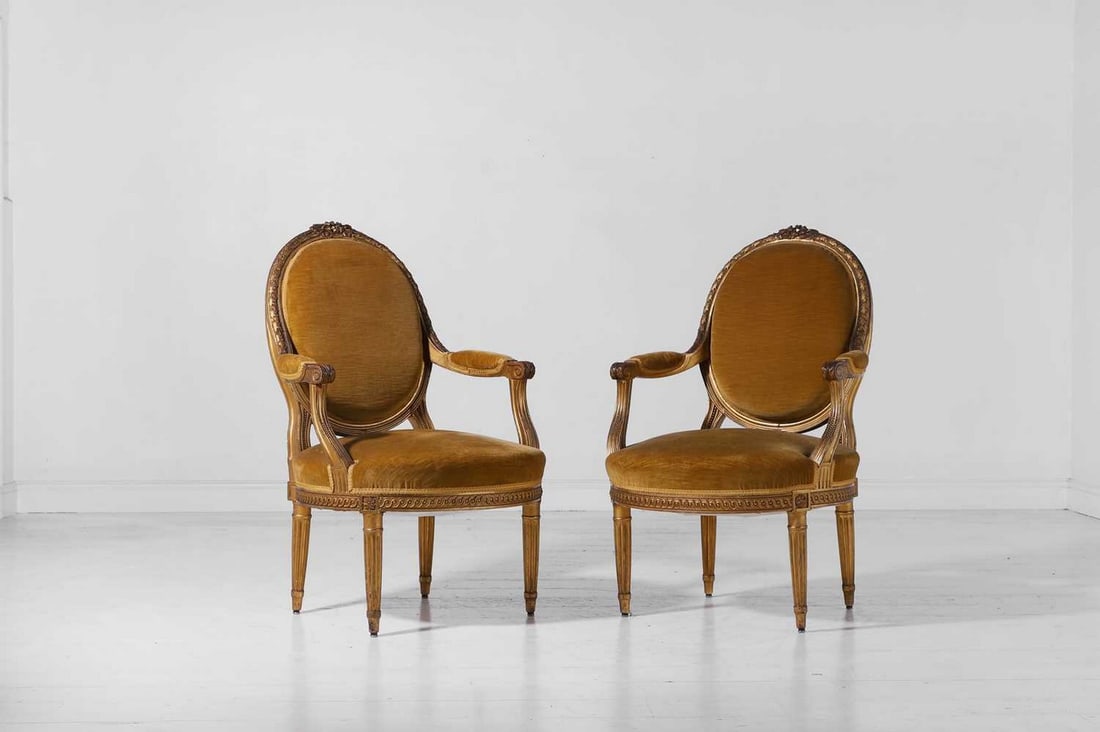 A pair of Louis XVI-style giltwood fauteuils,: A pair of Louis XVI-style giltwood fauteuils, late 19th/early 20th century, French, each with foliate detail and greenish-yellow velvet upholstery, 64cm wide 64cm deep 100cm high (2)