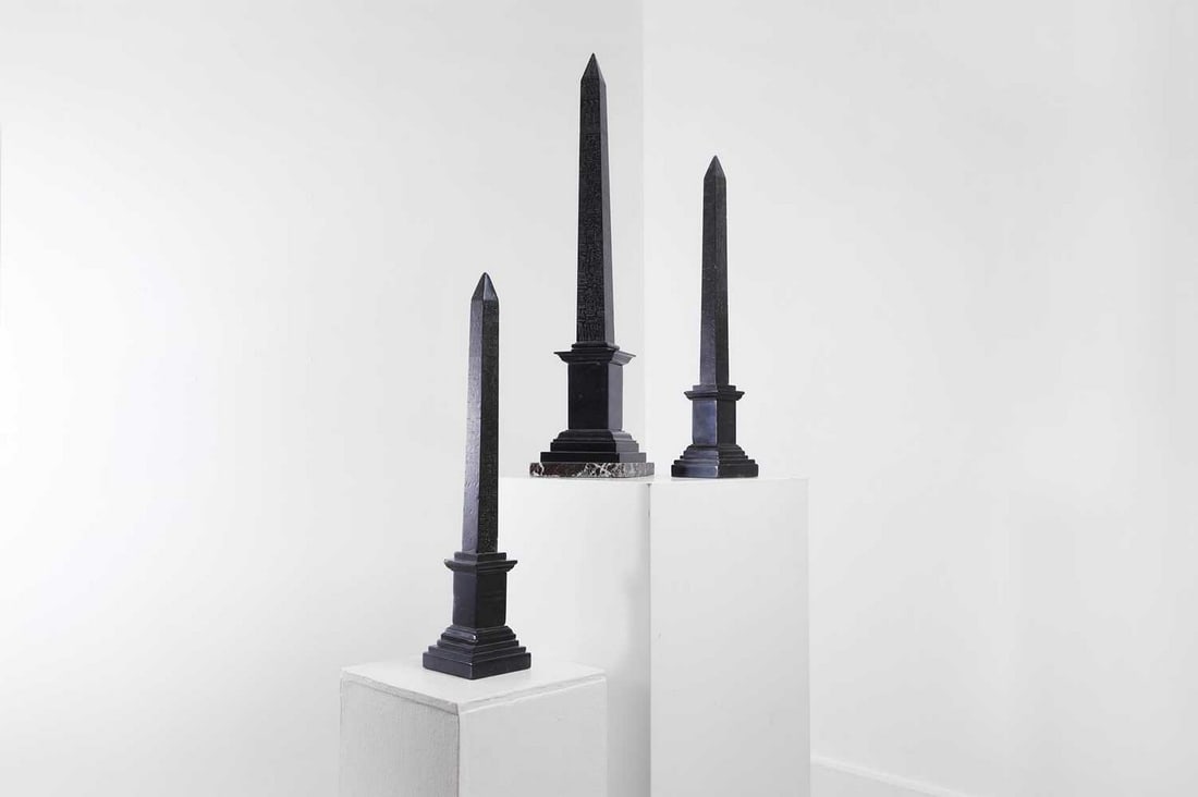 A group of three grand tour black marble obelisks, (1 of 6)
