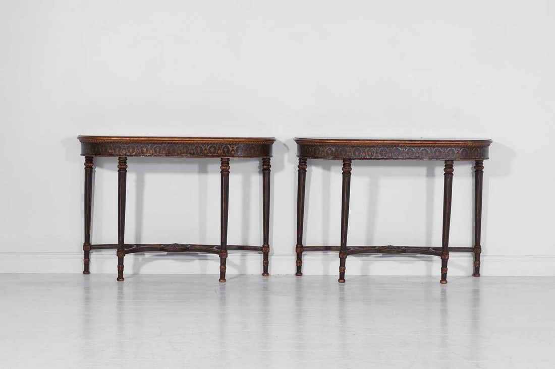 A pair of George III-style painted wooden console tables,: A pair of George III-style painted wooden console tables, of recent manufacture, each slender demilune top raised on tapering fluted supports, united by a pierced stretcher, with all-over neoclassical