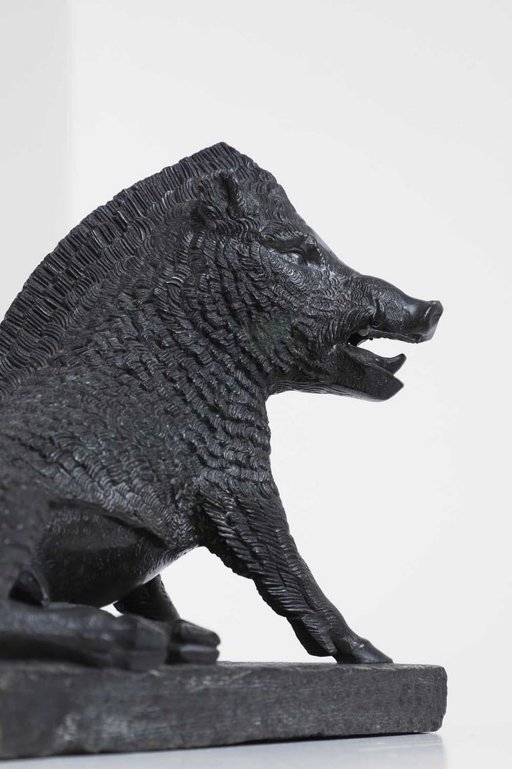 A carved serpentine marble model of the 'Porcellino' or Uffizi Boar, (1 of 6)