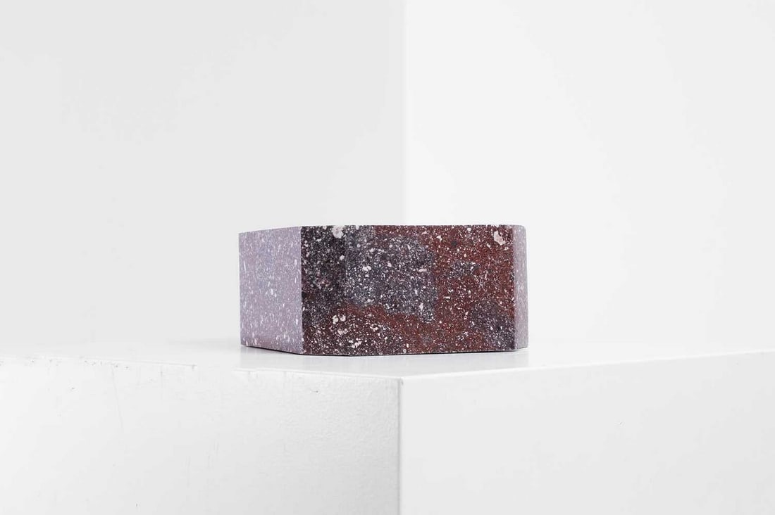 A polished imperial porphyry fragment,: A polished imperial porphyry fragment, of canted square form, 14.5cm wide 14.5cm deep 7.5cm high