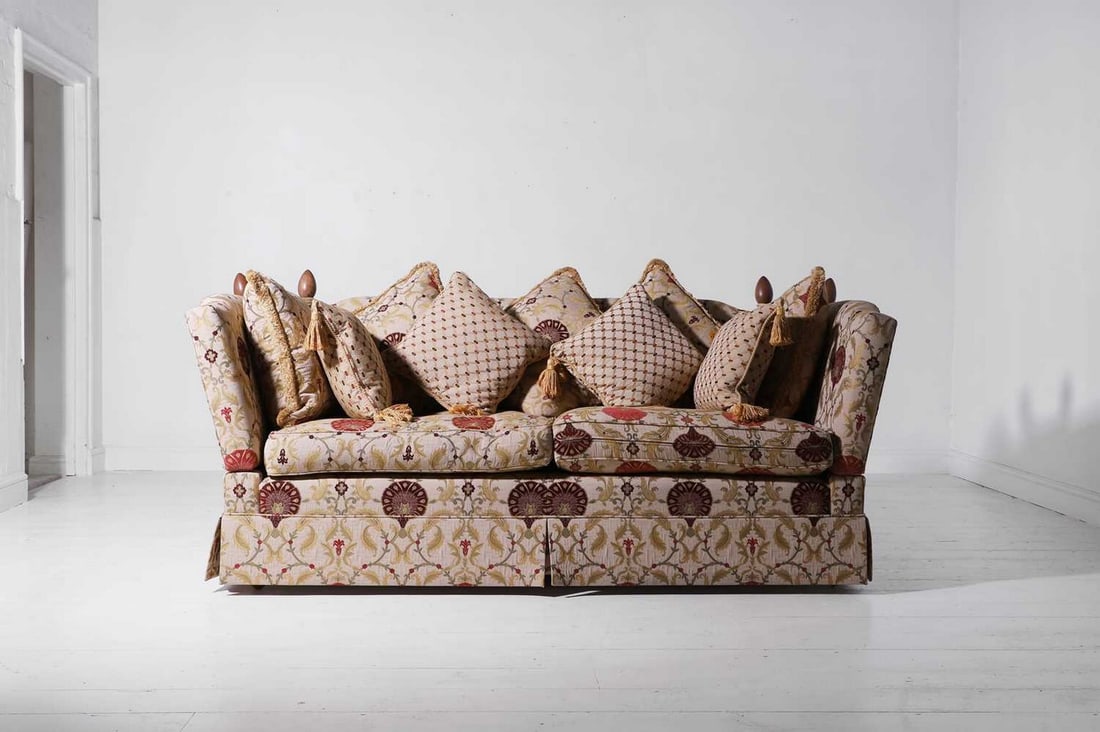 A two-seater Knole sofa,: A two-seater Knole sofa, late 20th century, of typical form with drop arms, upholstered in suzani-inspired fabric, 210cm wide 100cm deep 84cm high Provenance: An East Anglian Private Collection.