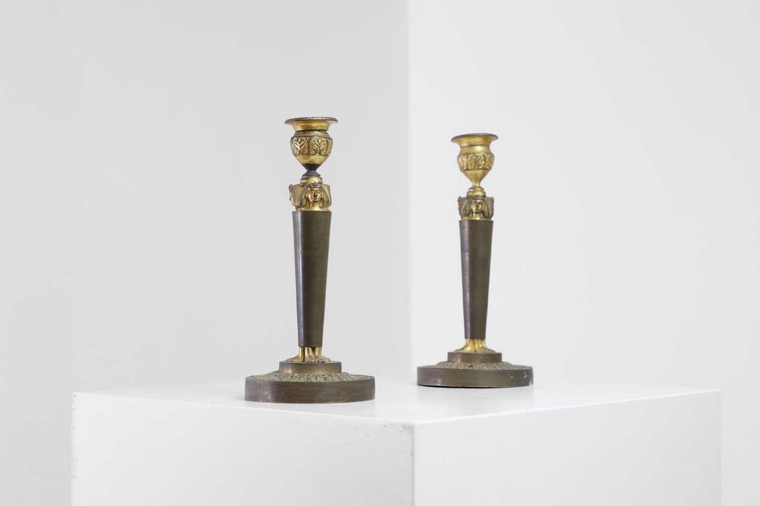 A pair of neoclassical gilt-bronze candlesticks, (1 of 4)