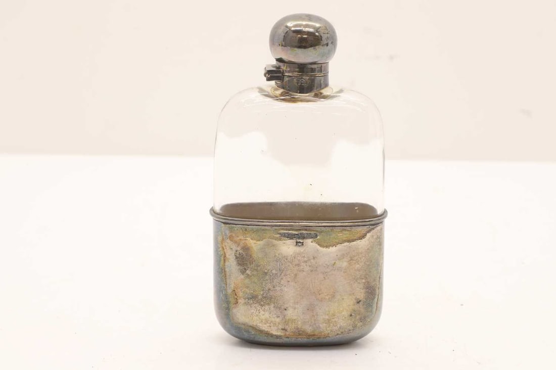 A silver mounted glass hip flask, (1 of 2)