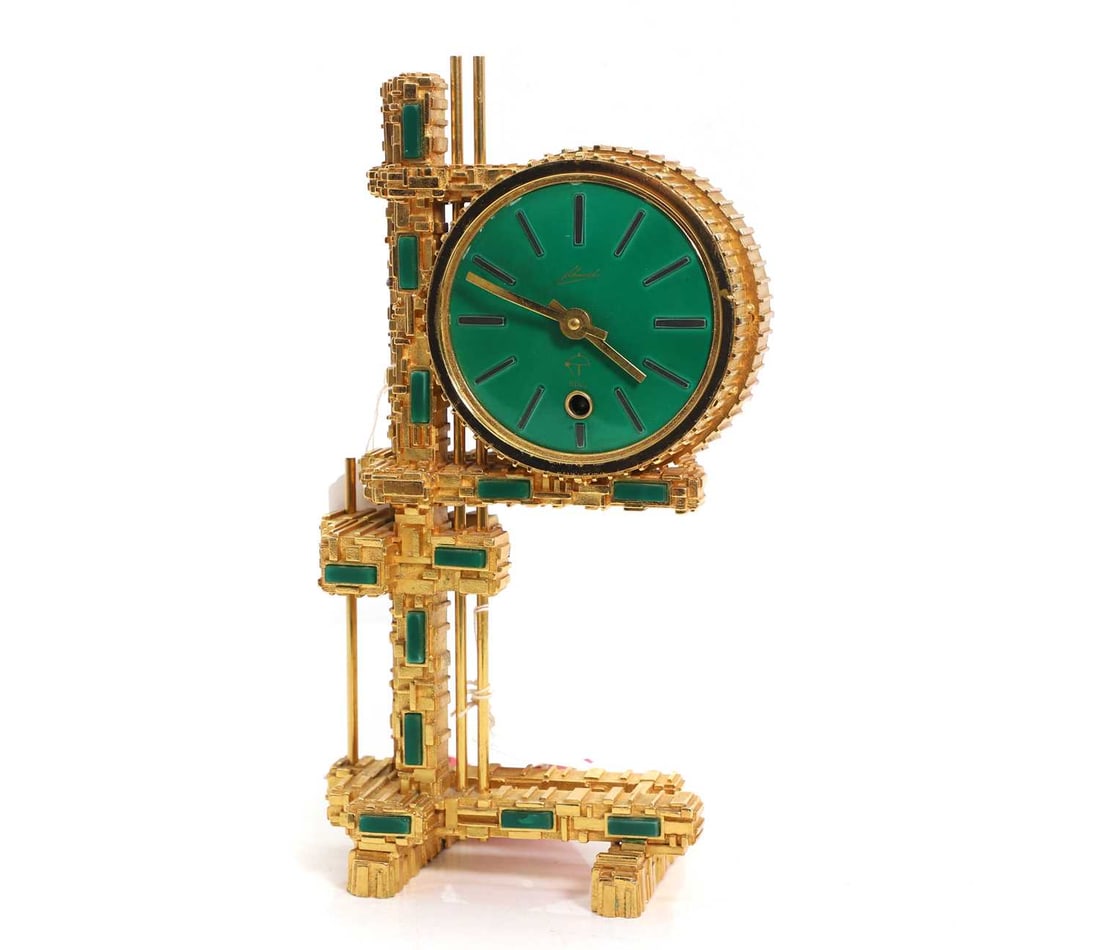 A Schmid Brutalist gilt metal and faux malachite mantel timepiece.: A Schmid Brutalist gilt metal and faux malachite mantel timepiece. c.1970, German, with a single train movement, complete with its pendulum,27.8cm high Condition Report The big hand is slightly bent.
