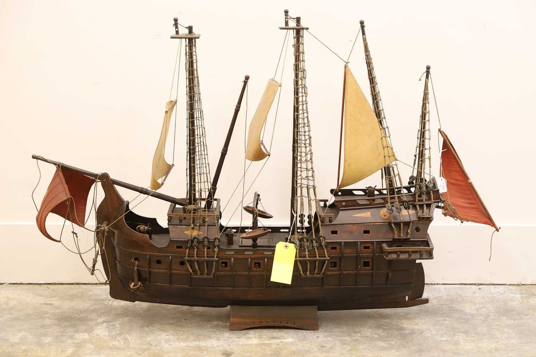 An Indian rosewood model of a Spanish galleon 20th century: An Indian rosewood model of a Spanish galleon 20th century In full scale with rigging, canvas sails, and a wooden stand 144cm wide, 34cm deep, 96cm high