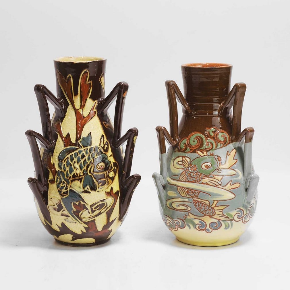 C H Brannam Pottery Two multi-handled vases: C H Brannam Pottery Two multi-handled vases Both dated 1894, one by James Dewdney, each incised and slip-glazed with panels of fish, and with three stepped handles, incised 'CH Brannam Barum, and one