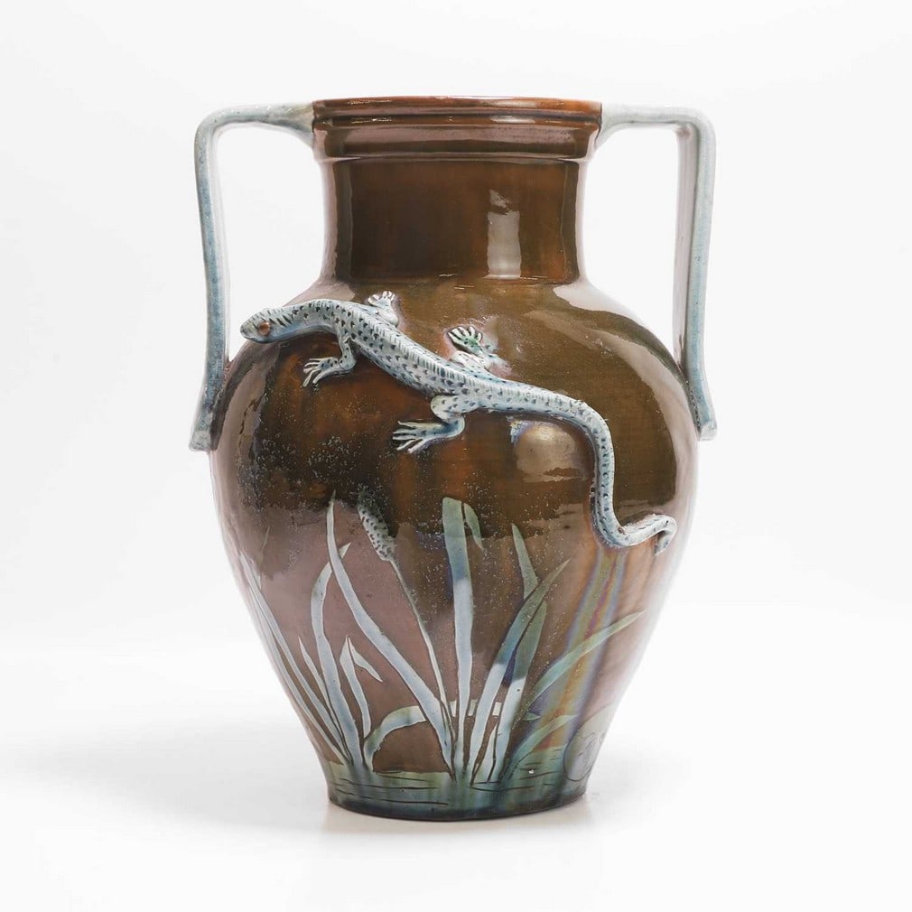 Edwin Beer Fishley (1832-1912) for Fremington Pottery A twin-handled vase: Edwin Beer Fishley (1832-1912) for Fremington Pottery A twin-handled vase c.1880, slip-glazed in brown and turquoise, the body applied with a lizard, and with bulrushes and lily pads, incised 'EB Fish