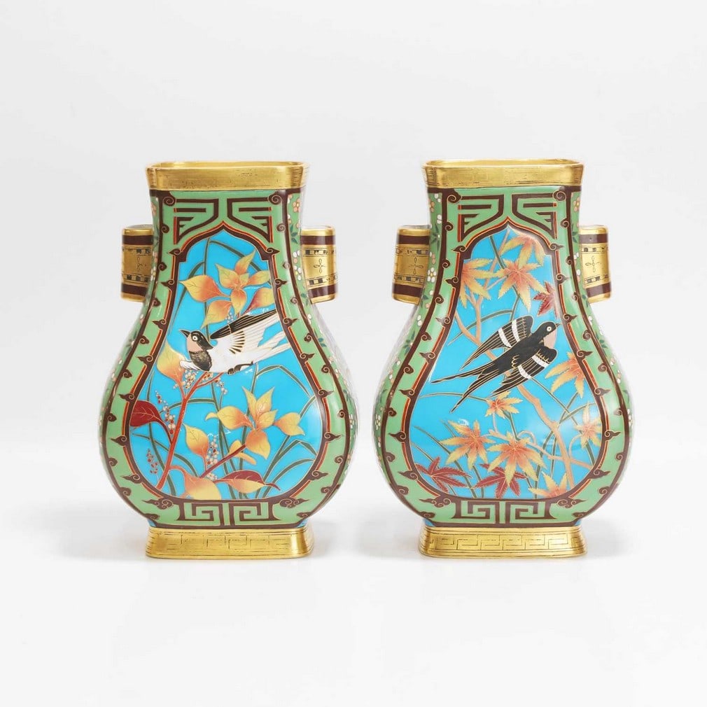 Dr Christopher Dresser (1834-1904) for Minton A near pair of cloisonné vases: Dr Christopher Dresser (1834-1904) for Minton A near pair of cloisonné vases Late 19th century, each of Hu form, depicting central panels with birds amongst flora and fauna to a blue ground, flan