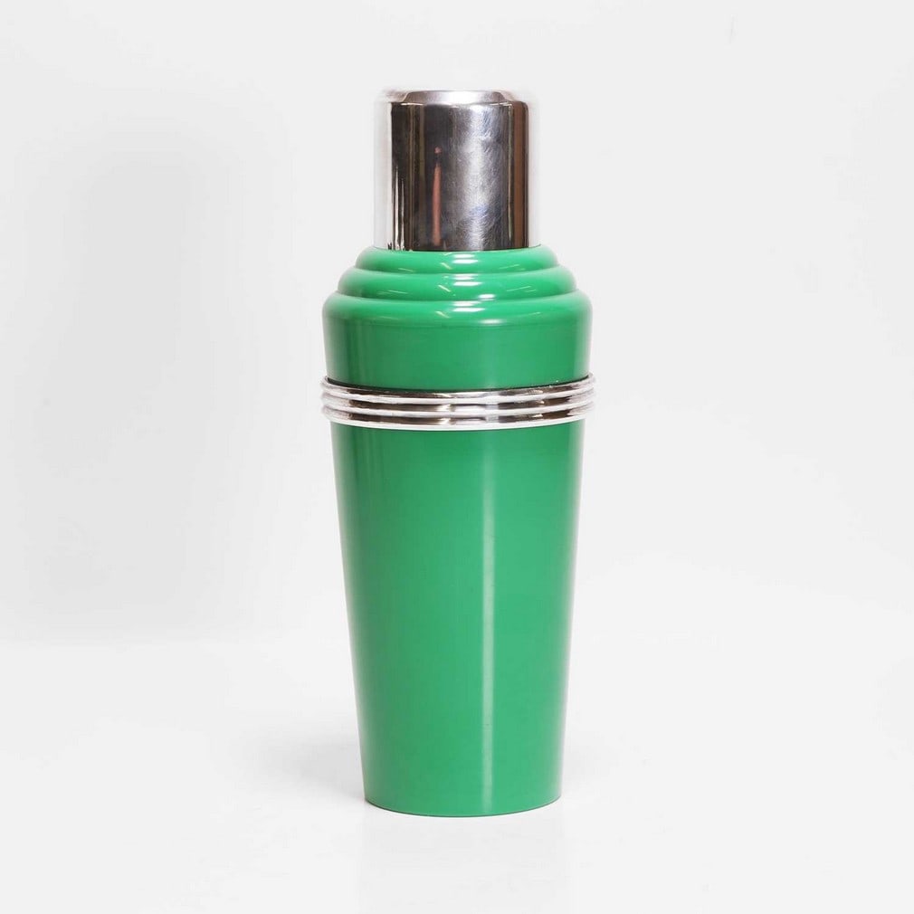 Art Deco A 'The Master Incolor' cocktail shaker: Art Deco A 'The Master Incolor' cocktail shaker Green Bakelite and silver-plated, 1930s, mounted with a spout, moulded marks to the underside (27.5cm high) Condition Report: Missing cap possibly on
