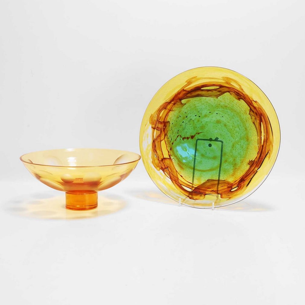 Peter Wheeler for Whitefriars A Studio Range 'Peacock' pattern glass plate: Peter Wheeler for Whitefriars A Studio Range 'Peacock' pattern glass plate c.1969, no. S14, and a similar Whitefriars-style amber glass bowl, c.1930/40, with engraved motifs (30.2cm diameter, the