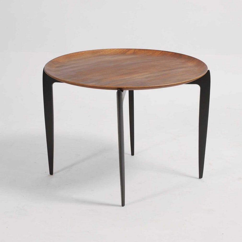 H Willumsen & S A Engholm (Danish) for Fritz Hansen An occasional table: H Willumsen & S A Engholm (Danish) for Fritz Hansen An occasional table Teak and ebonised wood, c.1958, the circle top over four tapered legs, labelled 'Made in Denmark 0468 Fritz Hansen' (59.5cm