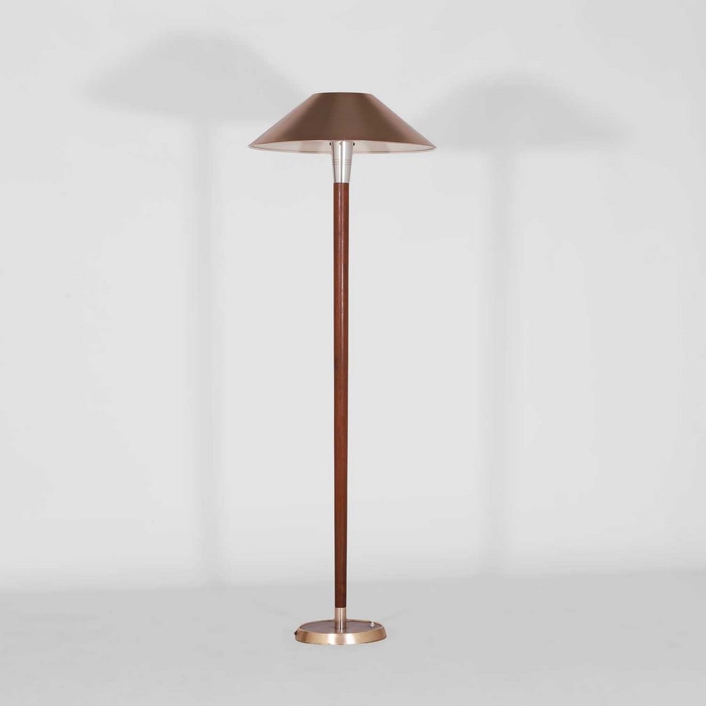 Paul Boissevain (Dutch, 1922-2014) for Merchant Adventurers Ltd. A floor lamp: Paul Boissevain (Dutch, 1922-2014) for Merchant Adventurers Ltd. A floor lamp Designed for the Festival of Britain in 1951, the teak tapering stem with an aluminium fitting to the top, raised on a