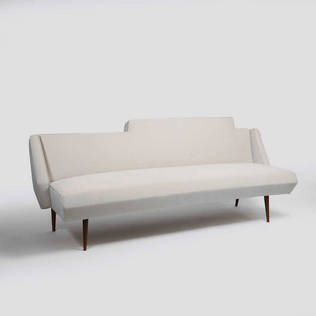 ▲ Augusto Romano (Italian, 1918-2001) A canapé sofa: ▲ Augusto Romano (Italian, 1918-2001) A canapé sofa 1952, later upholstered in white velvet, raised on four oak tapered legs (210cm wide, 75cm deep, 85cm high, seat 50cm) Condition Rep