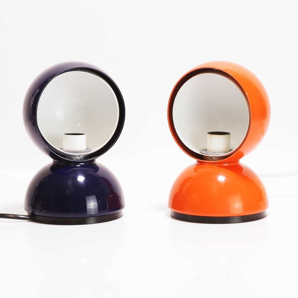 Vico Magistretti (Italian, 1920-2006) for Artemide A near pair of 'Éclisse' lamps: Vico Magistretti (Italian, 1920-2006) for Artemide A near pair of 'Éclisse' lamps Originally designed 1966, lacquered metal, one example in navy blue, the other in orange, with manufacturer's