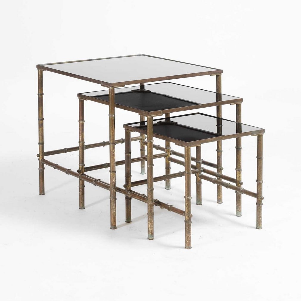 Attributed to Maison Jansen A graduated set of three tables: Attributed to Maison Jansen A graduated set of three tables 1960s, brass faux bamboo and black glass (The largest table: 48.5cm wide, 48.5cm deep, 48.5cm high) (3)