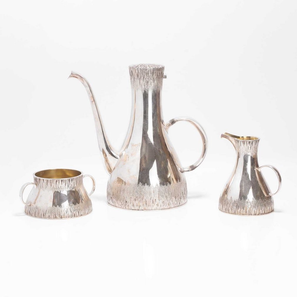▲ Christopher Nigel Lawrence (b.1936) A three-piece silver coffee service (1 of 3)