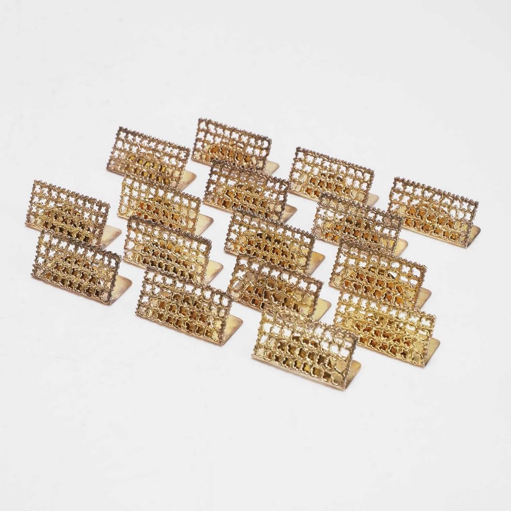 ▲ Stuart Devlin (Australian-British, 1931-2018) A set of sixteen silver-gilt menu holders (1 of 3)