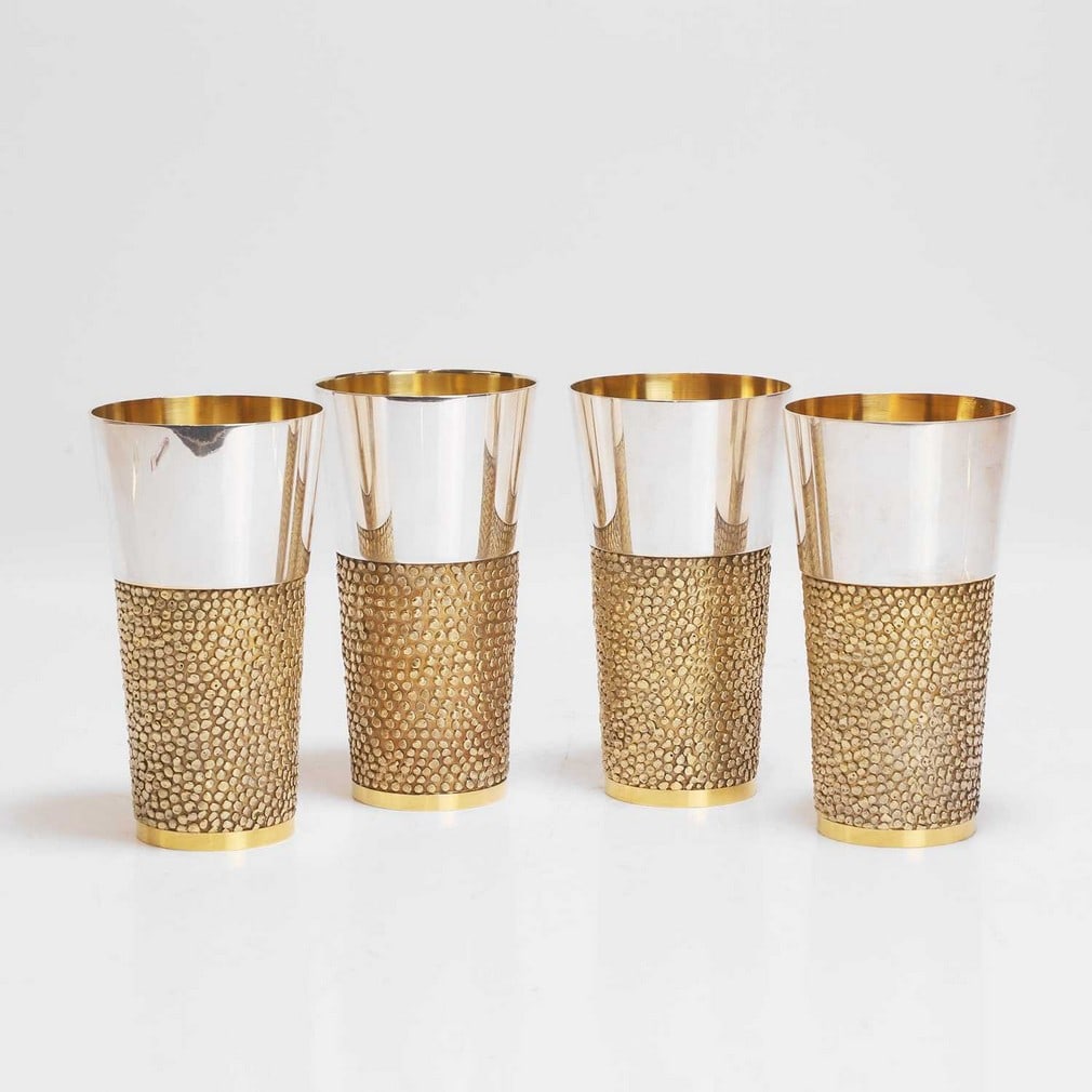 ▲ Stuart Devlin (Australian-British, 1931-2018) A set of four silver and silver-gilt tapering: ▲ Stuart Devlin (Australian-British, 1931-2018) A set of four silver and silver-gilt tapering cups Three dated London 1969 and one 1971, the upper section in polished silver, over a lower sectio