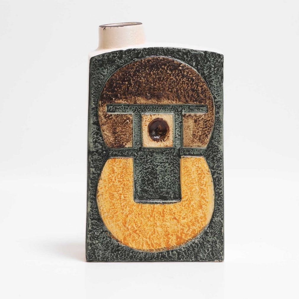 Avril Bennett for Troika Pottery A 'Chimney' vase: Avril Bennett for Troika Pottery A 'Chimney' vase Cast in low relief with geometric panels in shades of blue-green, orange, brown and buff, with plain sides, painted marks and artist's monogram 'AB'