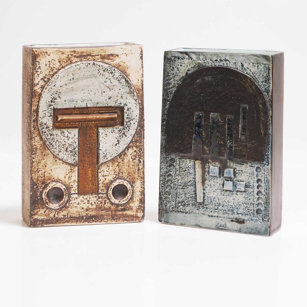 Honor Curtis and Sue Lowe for Troika Pottery Two rectangular vases: Honor Curtis and Sue Lowe for Troika Pottery Two rectangular vases Cast in low relief with geometric panels in shades of blue, brown and buff, painted marks, one 'St Ives' and artists' monograms,