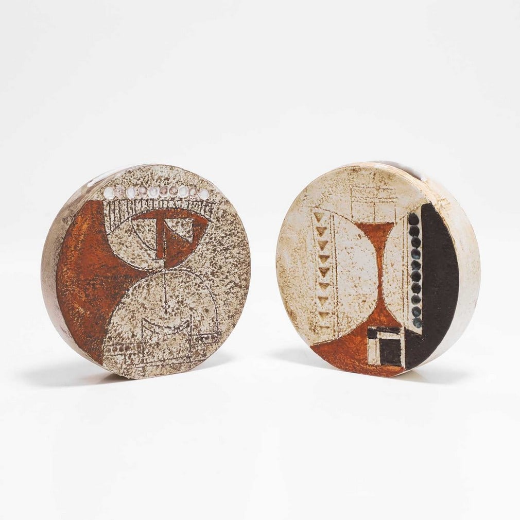 Honor Curtis for Troika Pottery Two 'Wheel' vases: Honor Curtis for Troika Pottery Two 'Wheel' vases Cast in low relief with geometric panels in shades of brown and buff, painted marks and artist's monogram's 'HC', one painted with 'St Ives' (each
