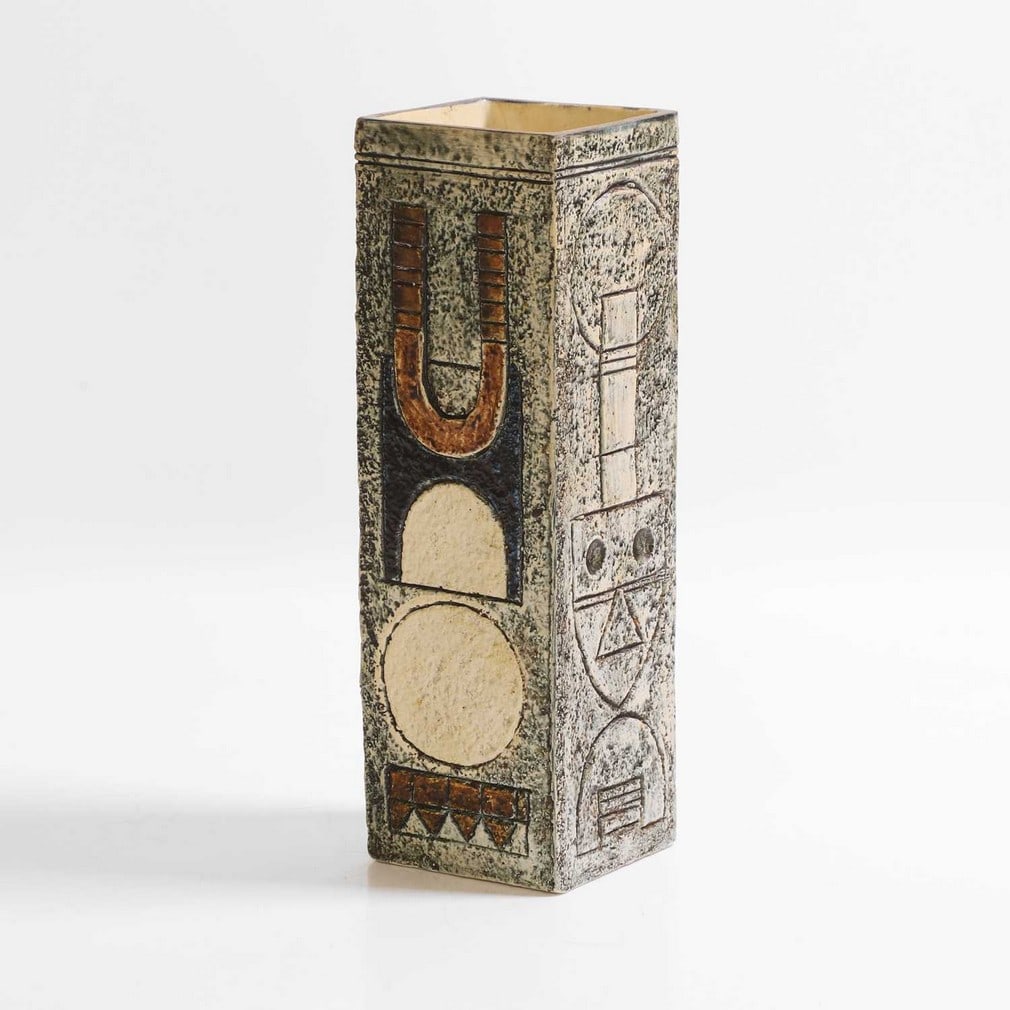 Troika Pottery A square-section vase: Troika Pottery A square-section vase Cast in low relief with geometric panels in shades of blue and buff, painted marks and artist's monogram (22.3cm high) Provenance: A private collection, Norfolk.