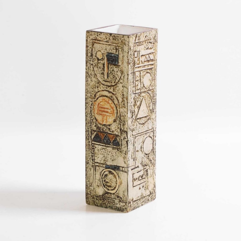 Troika Pottery A square-section vase: Troika Pottery A square-section vase Cast in low relief with geometric panels in shades of blue and buff, painted marks and artist's monogram (22.5cm high) Provenance: A private collection, Norfolk.