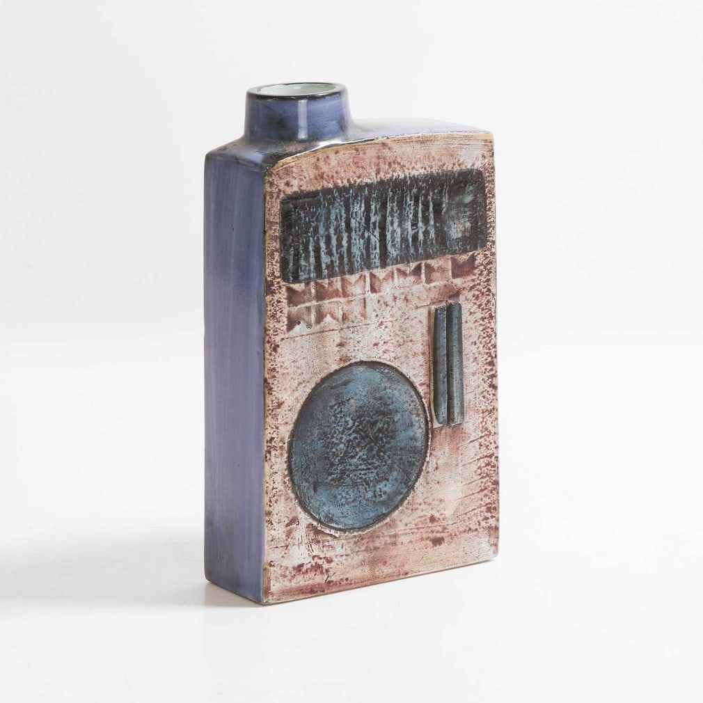 Marilyn Pascoe for Troika A 'Chimney' vase: Marilyn Pascoe for Troika A 'Chimney' vase Cast in low relief with geometric panels in shades of blue and buff, painted St Ives marks and artist's monogram MP' (20cm high) Provenance: A private