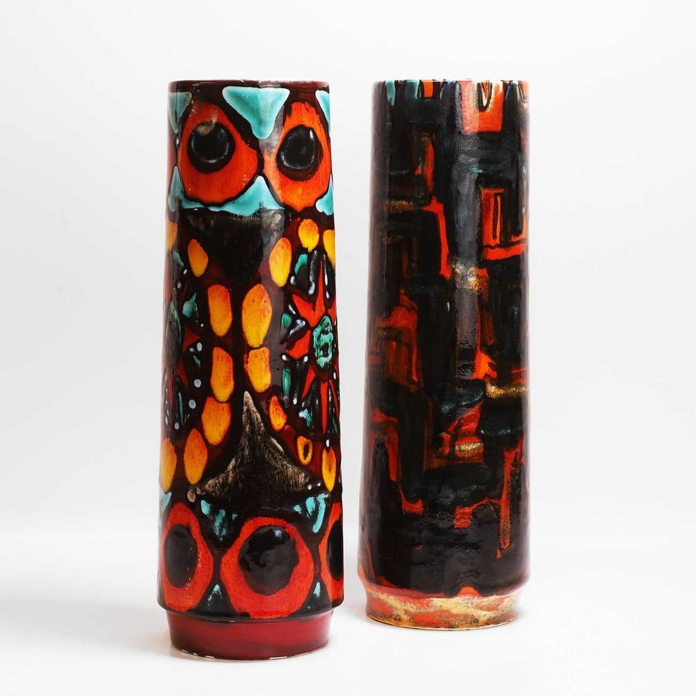 Poole Pottery Two cylindrical vases: Poole Pottery Two cylindrical vases Shape no.85, each of cylindrical form with incised designs, each with printed marks and artists' monograms (39.5cm and 40cm high) (2) Provenance: A private collecti