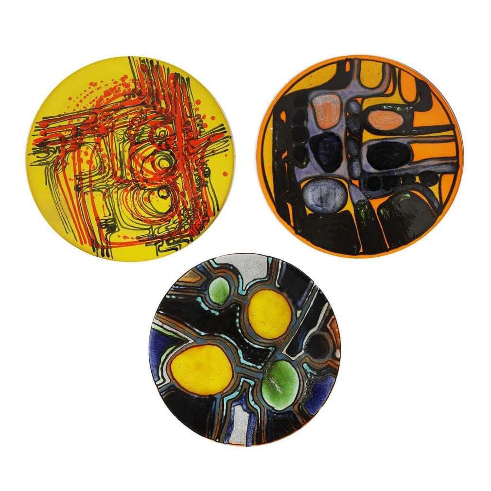 Poole Pottery Three 'Delphis' Studio chargers: Poole Pottery Three 'Delphis' Studio chargers Shape no.54, printed marks and artists' marks (each 41.5cm diameter) (3) Provenance: A private collection, Norfolk. Condition Report: One restored. G