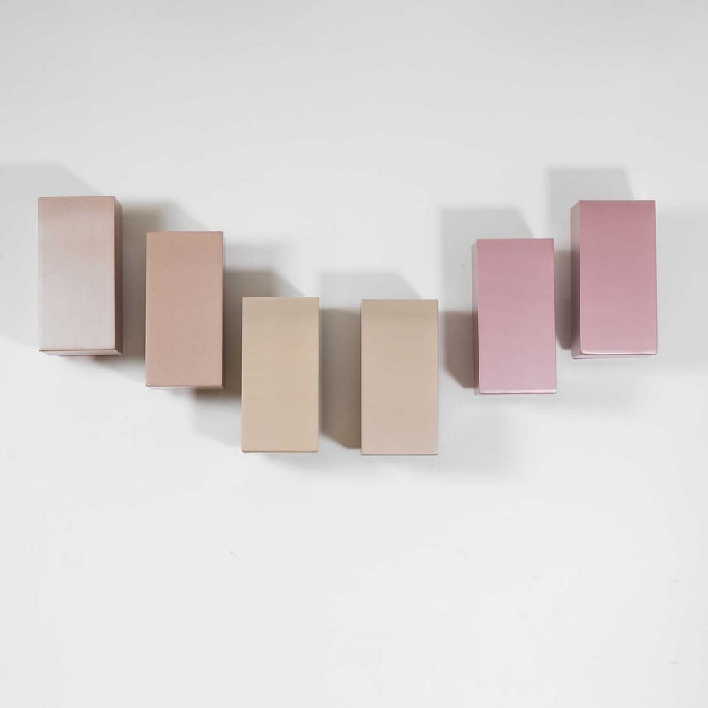 A set of six aluminium uplighters 1970s: A set of six aluminium uplighters 1970s Three pairs in three different powder-coated colours (15cm wide, 22cm deep, 30.5cm high) (6)