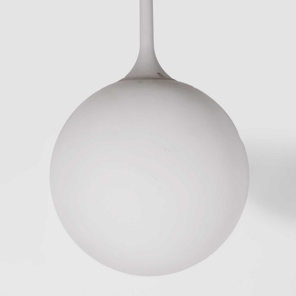 Artemide A suspension light: Artemide A suspension light Of recent manufacture, the white frosted glass shade of spherical form mounted to a white plastic fitting, with manufacturer's label (40cm diameter, 79cm high)