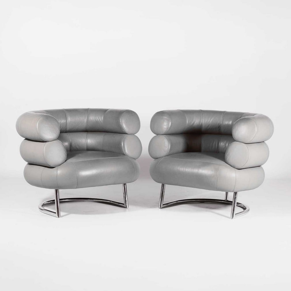 Eileen Gray (Irish, 1878-1976) for Classicon A pair of 'Bibendum' armchairs: Eileen Gray (Irish, 1878-1976) for Classicon A pair of 'Bibendum' armchairs Originally designed in 1926, manufactured by Aram Design Ltd., with a barrel bolster back upholstered in grey leather,