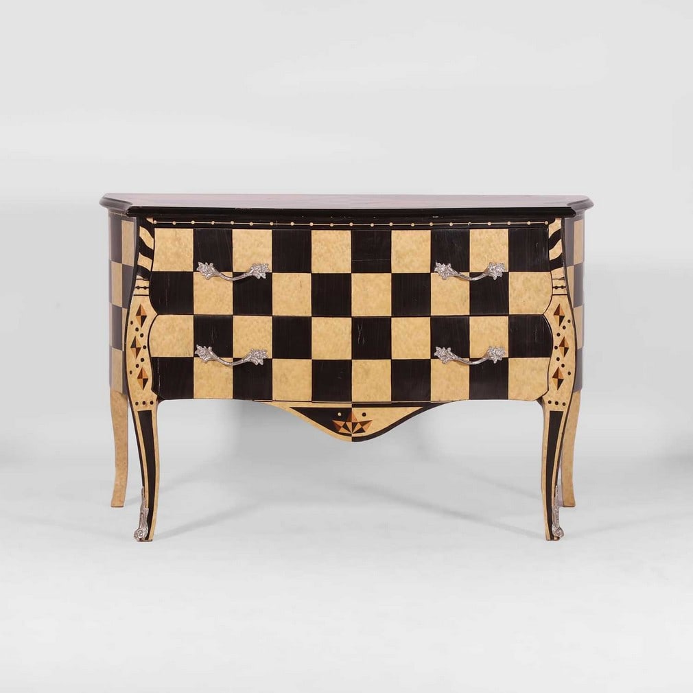 Attributed to Roche Bobois A chest of drawers: Attributed to Roche Bobois A chest of drawers Of recent manufacture, in the style of Louis XV, with geometric marquetry pattern, with silvered-metal handles (127cm wide, 65.5cm deep, 82cm high)
