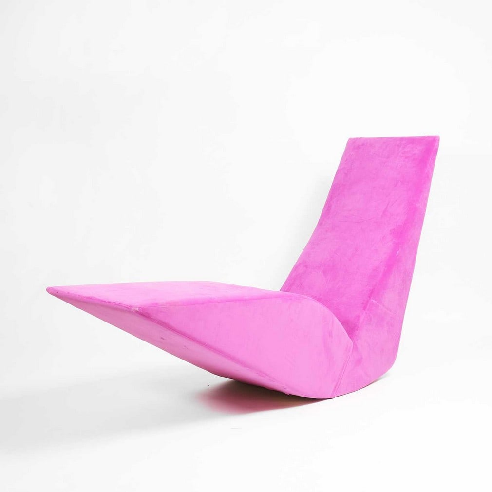 Tom Dixon (b.1959) A 'Bird' chaise longue: Tom Dixon (b.1959) A 'Bird' chaise longue 1990s, originally manufactured by Cappellini, Italy, the wooden frame with fuchsia moleskin upholstery (51cm wide, 165cm deep, 101cm high, seat 42cm)
