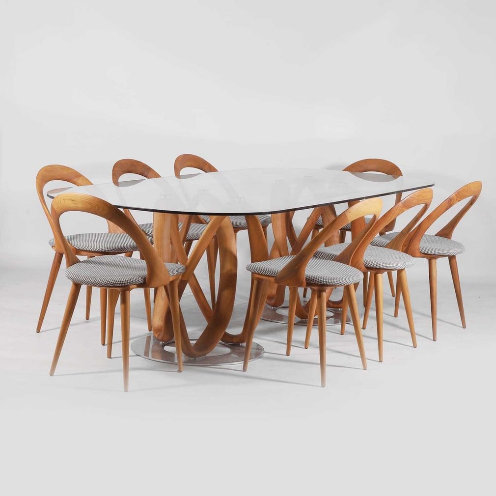 Stefano Bigi (French-Italian, b.1974-) for Porada A dining suite: Stefano Bigi (French-Italian, b.1974-) for Porada A dining suite Of recent manufacture, comprising a glass top 'Infinity' dining table, raised on two walnut and chrome bases, and eight 'Ester' walnut