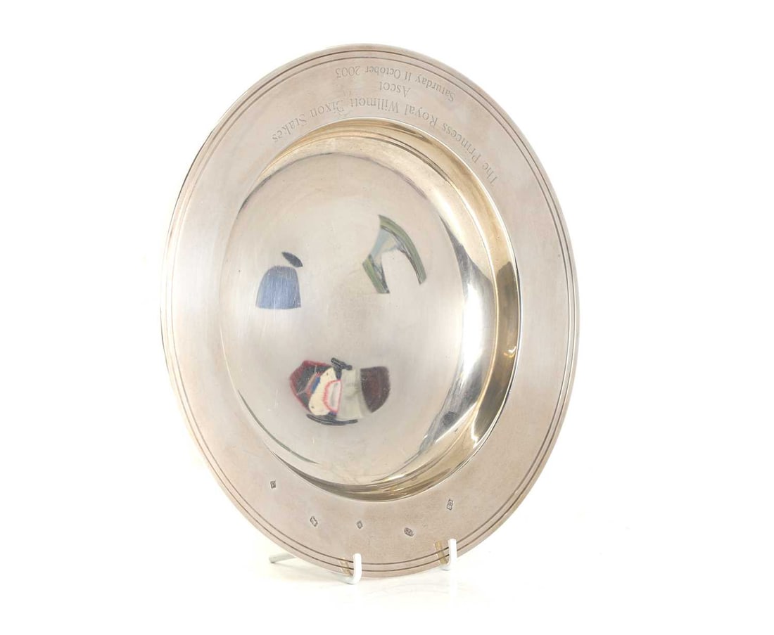 A silver presentation dish: A silver presentation dish By Camelot Silverware Ltd, Sheffield, 2003 with double banded rim, and inscribed 'The Princess Royal Willmott Dixon Stakes Ascot Saturday 11 October 2003' 25.5cm