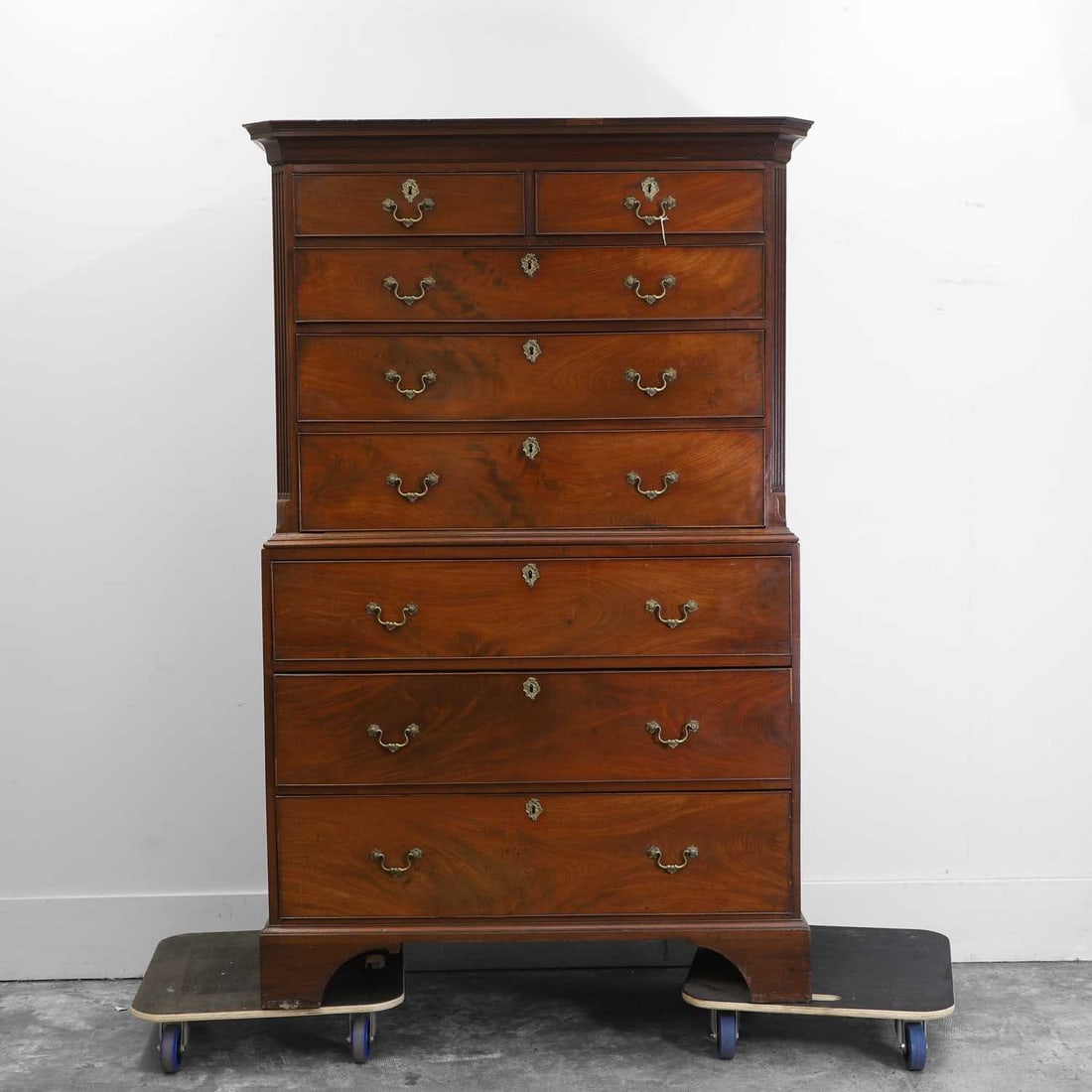 A George III mahogany chest on chest 18th / 19th century: A George III mahogany chest on chest 18th / 19th century With canted corners on bracket feet, the top section with two short drawers over three long drawers, the base with three long drawers 