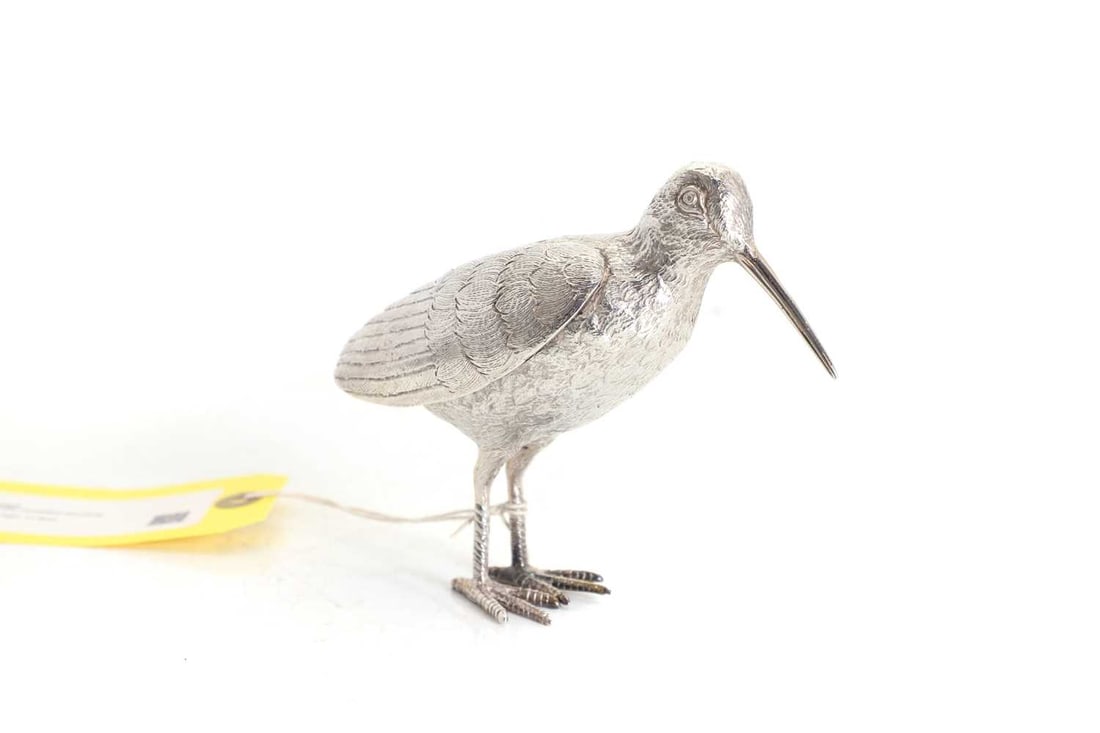 A silver model of a snipe: A silver model of a snipe By L A G, London, 1964, modelled standing 15.5cm wide, 12.3cm high, 11.8ozt Condition Report: Tail is bent and has a slight wobble on a flat surface. 