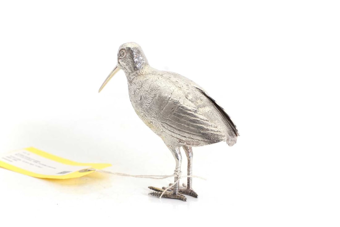 A silver model of a snipe - 2