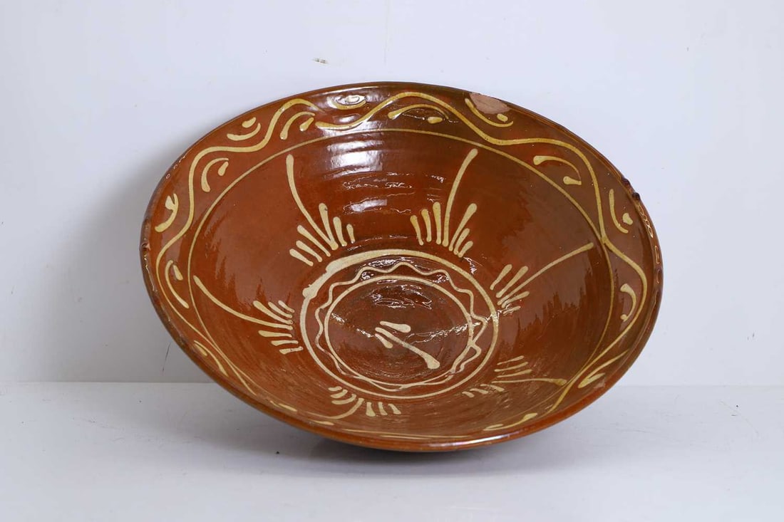 An earthenware slip ware bowl late 19th century (1 of 2)