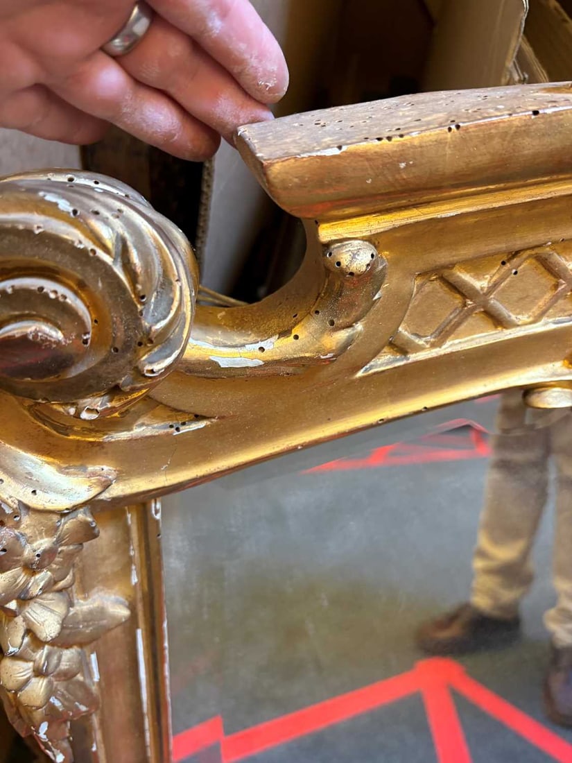 A gilt framed wall mirror, - 19