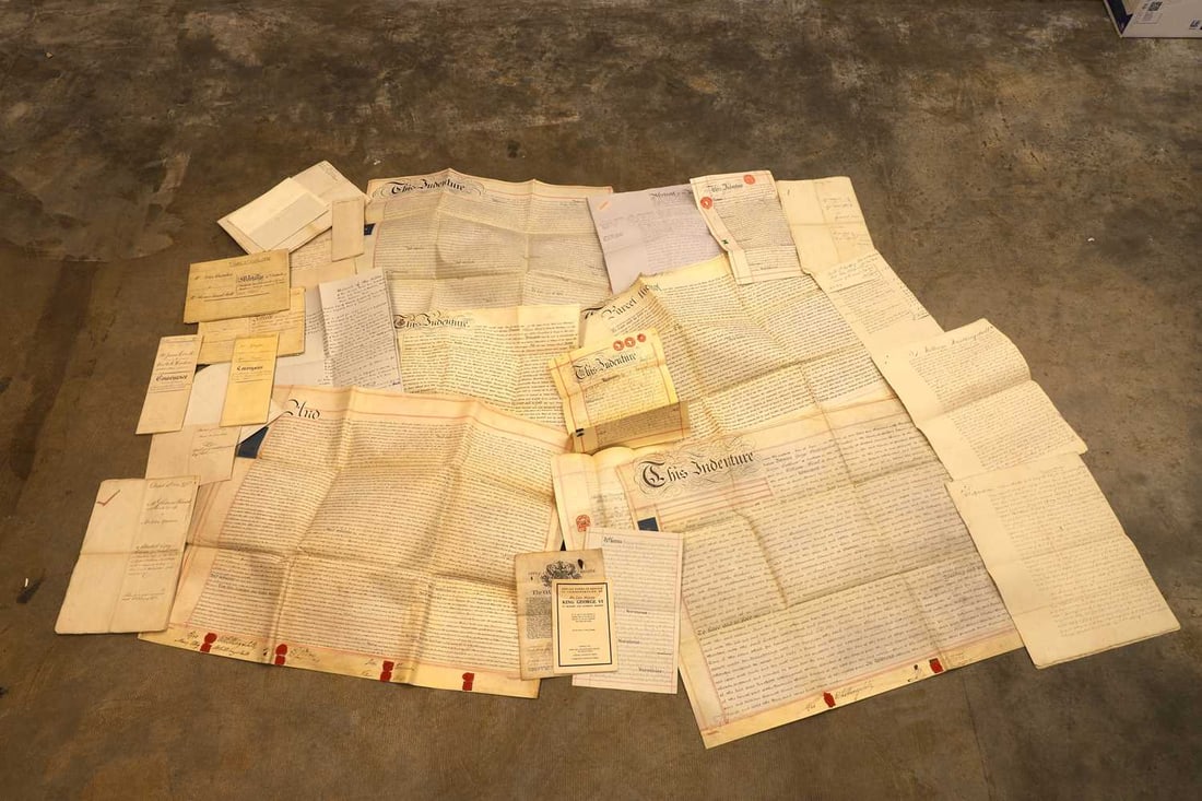 A collection of deeds and indentures 18th century and later: A collection of deeds and indentures 18th century and later to include mortgage agreements, an Oath of Burgess, and leases qty. Condition Report: Some pieces discoloured and foxed, edges slightly