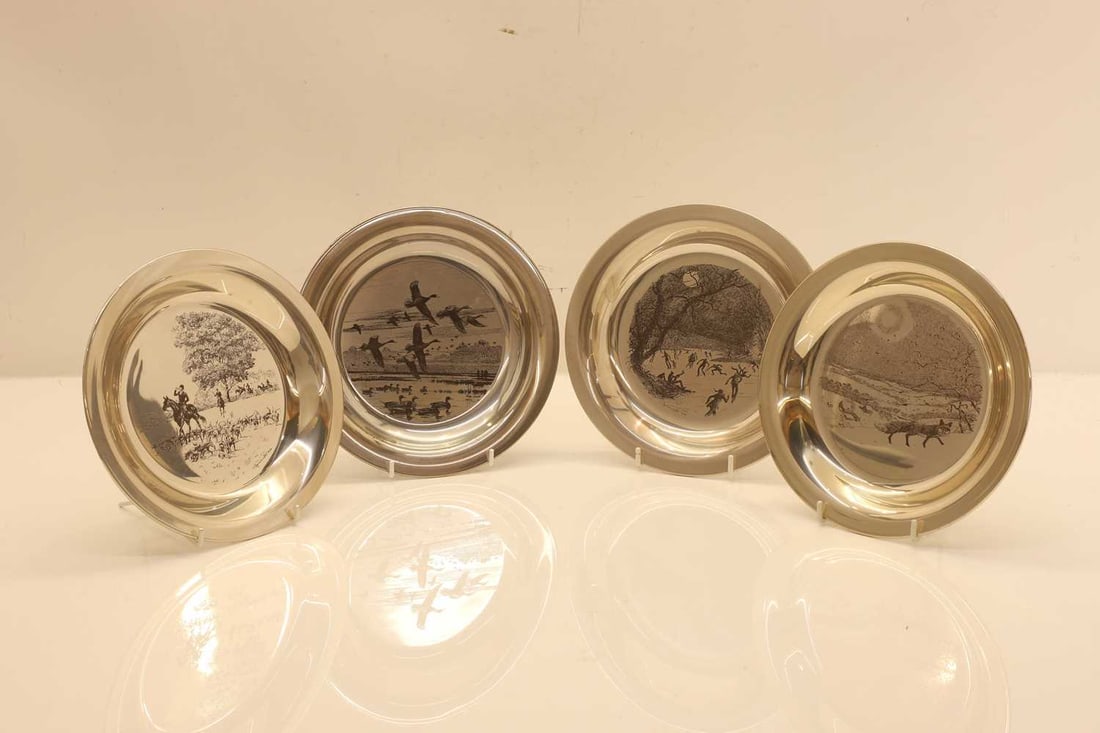 A collection of four silver plates 20th century (1 of 2)