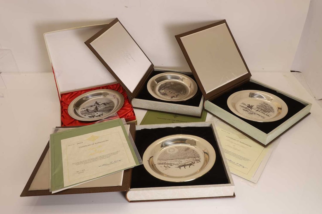 A collection of four silver plates 20th century - 2