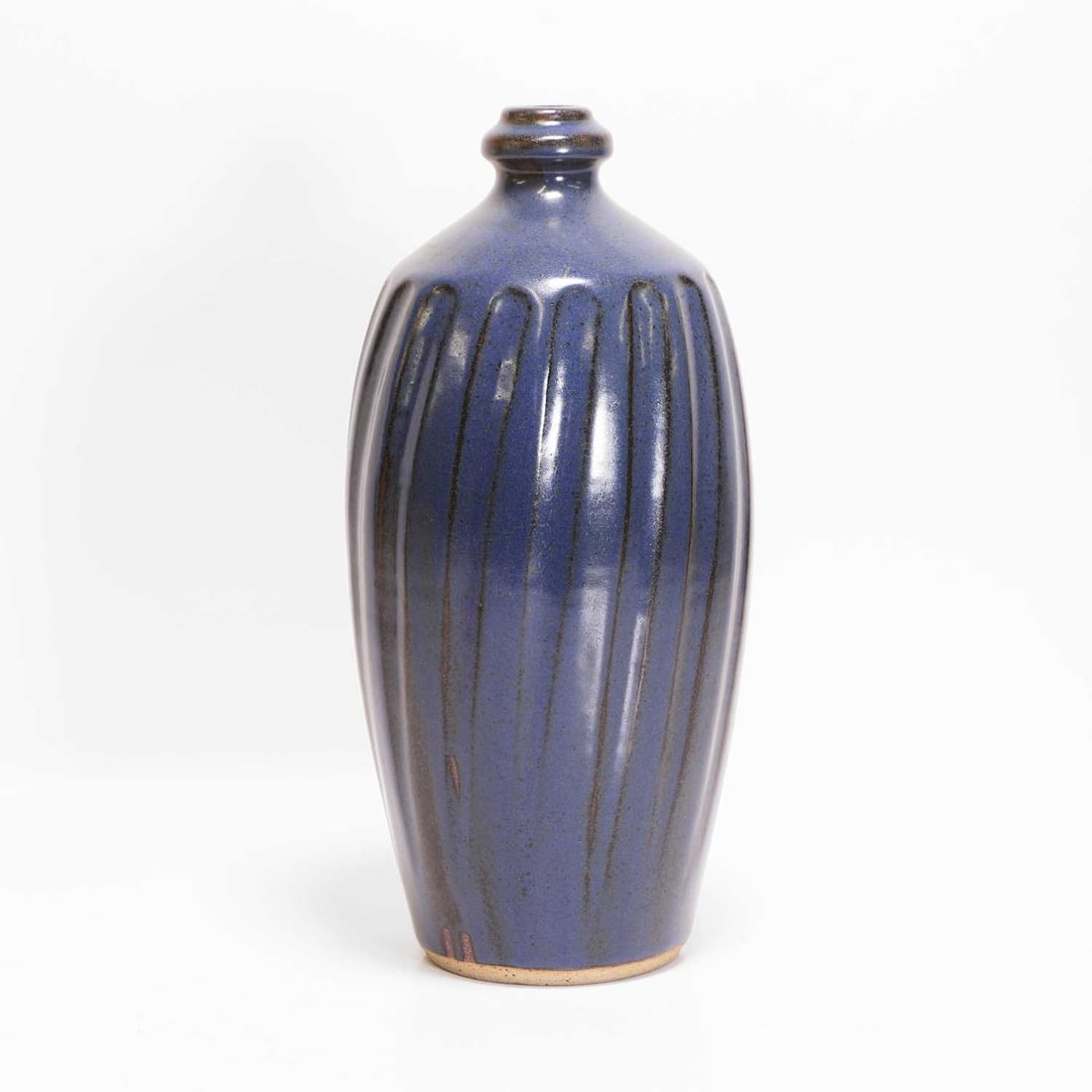 Nick Rees (b.1949) for Muchelney Pottery A stoneware bottle vase: Nick Rees (b.1949) for Muchelney Pottery A stoneware bottle vase With a blue glaze with an incised spiral body, impressed mark and artist's seal 31.5cm high Provenance: A private collection,