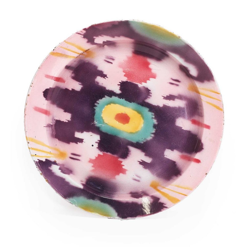 A Soviet pottery charger by the Kuznetsov Porcelain Factory, early 20th century, Dulevo, Russia,: A Soviet pottery charger by the Kuznetsov Porcelain Factory, early 20th century, Dulevo, Russia, made for the Eastern market, with ikat-style decoration, printed and impressed marks to base (36cm diam