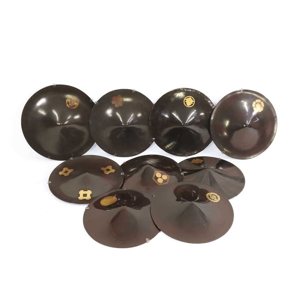 A group of nine black-lacquered Samurai 'jingasa' hats, Edo period (1603-1868), Japanese, (1 of 2)